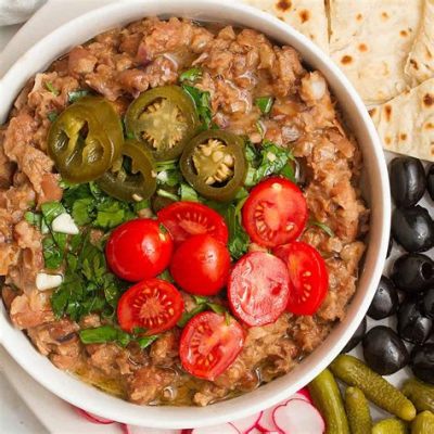  Ful Medames: Een romige bonenschotel vol warme kruiden en pikante texturen!